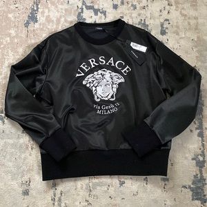 Black and white women’s Versace sweater, size 44, new with tags, hanger and bag